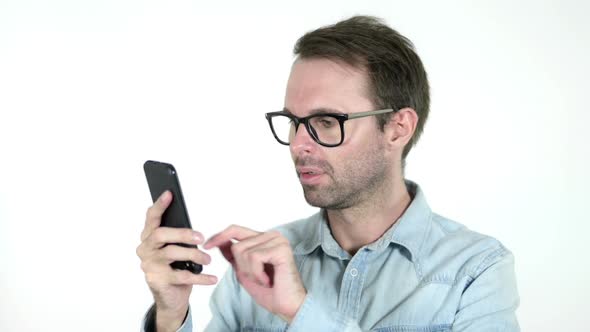 Man Reacting to Loss and Using Smartphone White Background