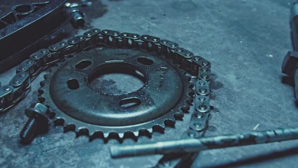 On the Metal Table Lie the Tools and Spare Parts of the Car Mechanic