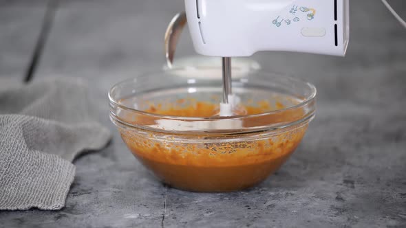 Process of Making the Caramel Dough Woman's Hand Whips Cake Batter