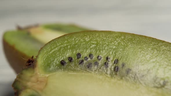 Close-up of ripe kiwi on a wooden background. 
