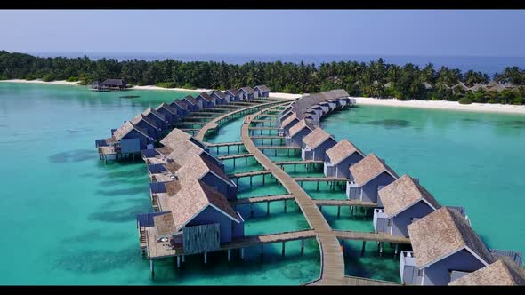 Aerial drone nature of relaxing bay beach wildlife by blue green lagoon and white sandy background o