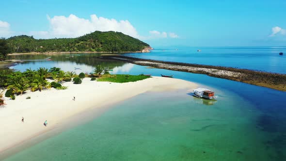 Aerial above seascape of marine coast beach adventure by blue lagoon and bright sandy background of 