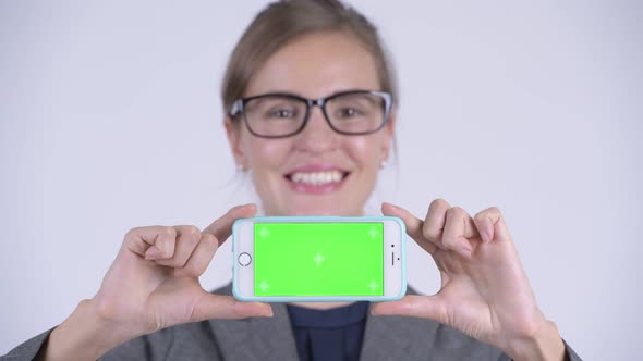 Face of Young Happy Businesswoman Showing Phone