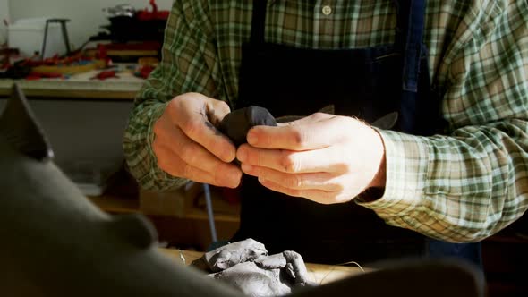 Craftsman working on clay sculpture 4k