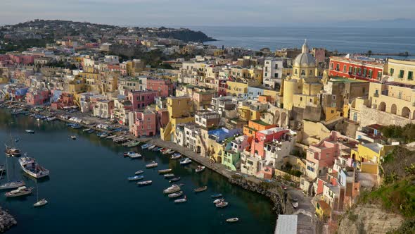 Procida Island, Italy, Panoramic Shot of Multi-colored Buildings and Yellow Church, Boats Moored 