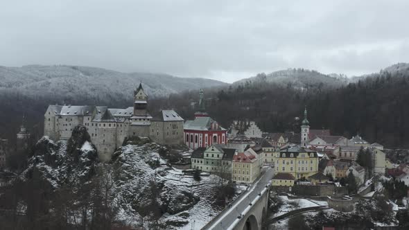 Loket Castle and Old City at Winter. Aerial View of Bridge and Medieval Landmark on Cloudy Day, Dron