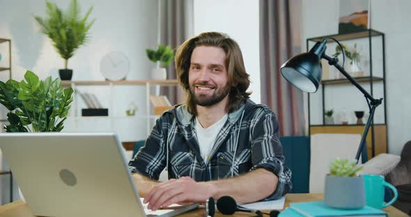 Man in Casual Clothes which Showing Sign Thumb Up into Camera in Home Office