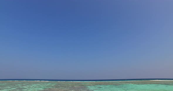 Tropical aerial clean view of a white sand paradise beach and aqua blue water background in high res