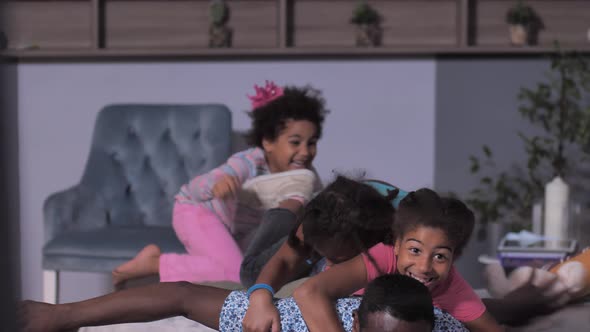 Joyful Black Dad and His Girls Having Fun at Home