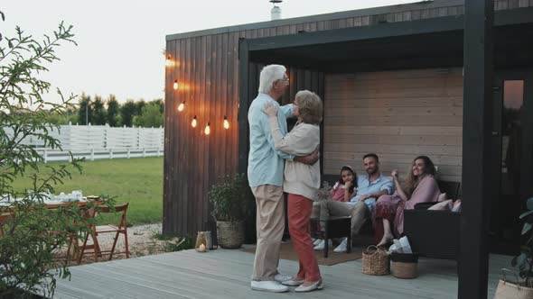 Senior Couple Dancing on Terrace