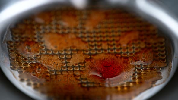 Super Slow Motion Macro Shot of Dripping Fresh Espresso Coffee From Lever Machine at 1000 Fps