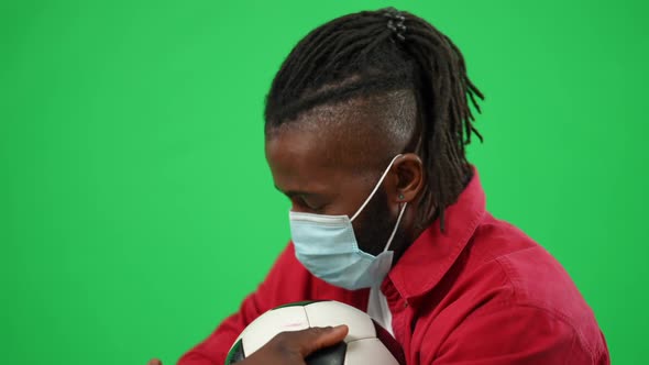 Disappointed African American Soccer Fan in Coronavirus Face Mask Supporting Team Watching Match at