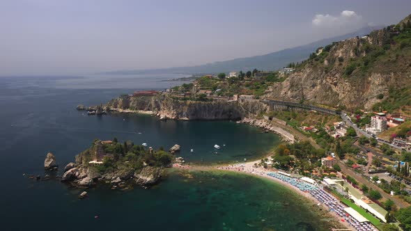 Drone shot of Isola Bella a small island near Taormina, Sicily, southern Italy. Also known as The Pe