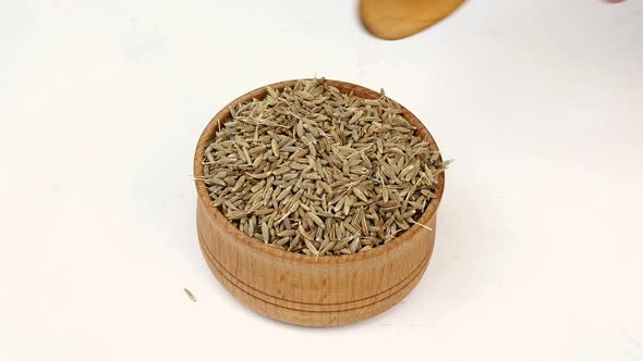 Chef Taking Chopped Dry Cumin Seeds or Zira Spices From Wooden Spice Jar