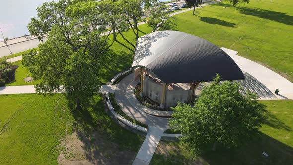 Aerial view of newly completed shelter over stage venue in La Crosse, Wisconsin, park in summer.