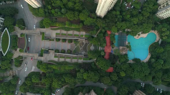 Aerial Vertical Shot Over Residential Apartment Buildings on Sunset. Aerial Shot Over Community