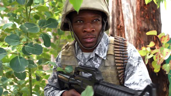 Military soldier guarding with a rifle