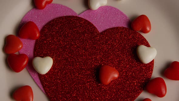 Rotating stock footage shot of Valentines decorations and candies - VALENTINES 0104