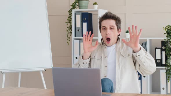 Caucasian Millennial Adult Business Man Get Ready for Work Male Freelancer Sitting at Table in Home