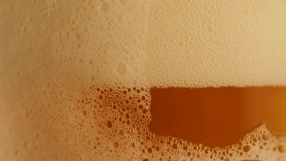 Pouring Fresh Beer with Foam Running Down Slowmotion Footage