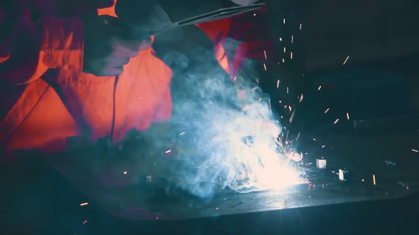 Metal Welder Working with Arc Welding Machine