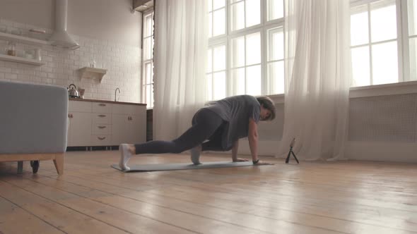 Young Woman Starts her Online Fitness Training