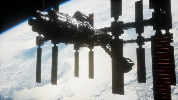 A View of the Earth and a Spaceship. ISS Is Orbiting the Earth alt