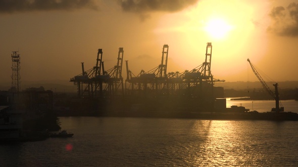 A cruise ship goes to the open sea from the seaport of a large city