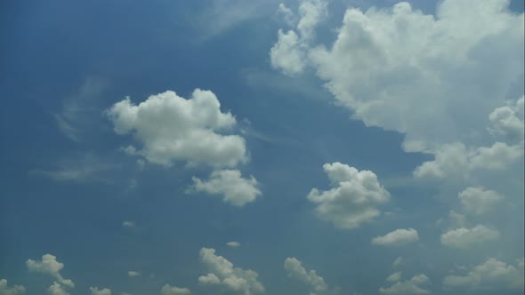 Time lapse of white cloud moving pass around sky background