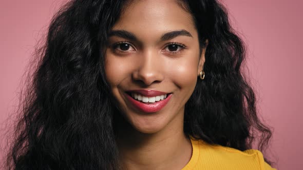 Close up portrait of smiling young African woman.  Shot with RED helium camera in 8K.