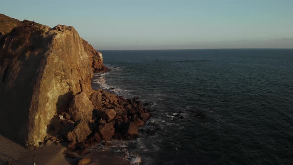 An Aerial Shot of the Point Dume Cliffs in Malibu in California as the Waves Crash Against the Rocks