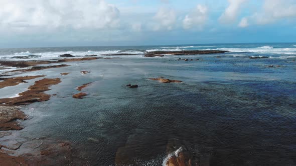 Flight Over the Blue Ocean Water at the Irish West Coast