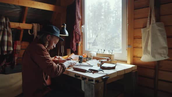 Craftsman Using Hammer for Leather Work