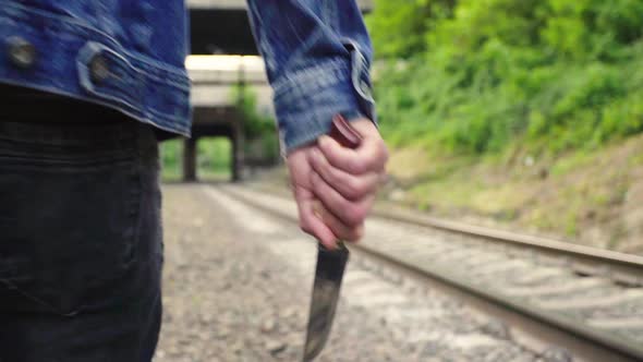 Maniac with a Knife Near the Railway Tracks.