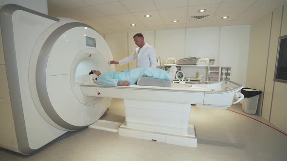 Magnetic Resonance Imaging Adult Professional Doctor Performs a Magnetic Tomographic Examination of