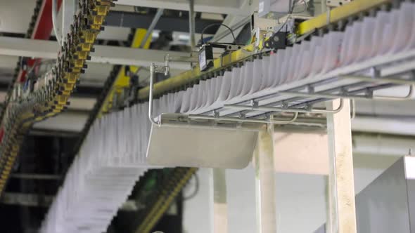 Conveyor with Numerous Freshly Printed Papers.