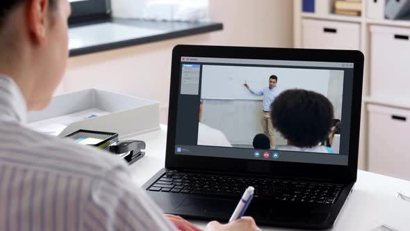 Woman with Laptop Having Video Call at Office