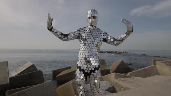 Sparkling Discosuit Man Dancing Next to the Sea