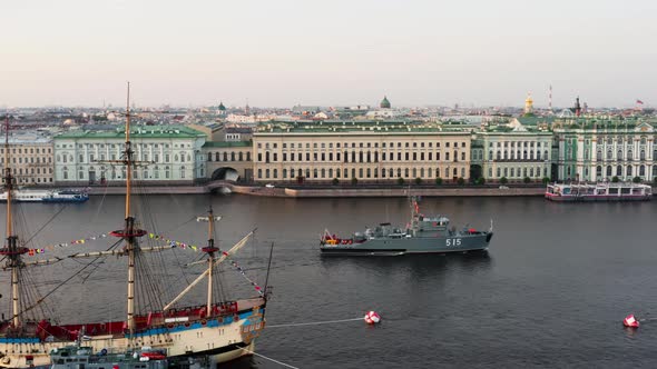 Aerial Landscape of a Modern Military Boat Goes Along the Palace Embankment at Early Morning a