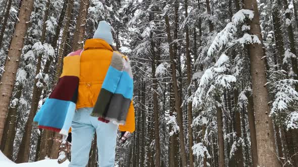 Woman Enjoying Winter Time in the Forest