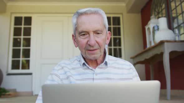 Senior caucasian man using laptop computer for video chat