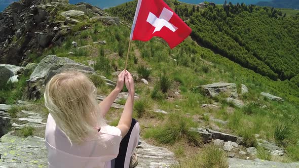Woman with Swiss Flag on Cardada Mount