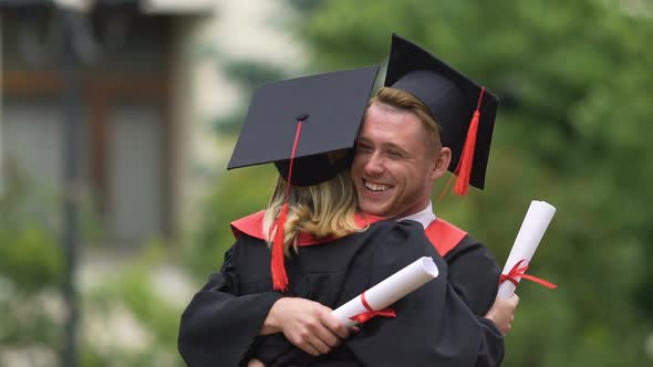 Warm Emotions of University Friends Hugging After Diploma Awarding Ceremony