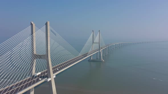 Lisbon Portugal Aerial View of the Vasco Da Gama Bridge on a Foggy Beautiful Morning During Car