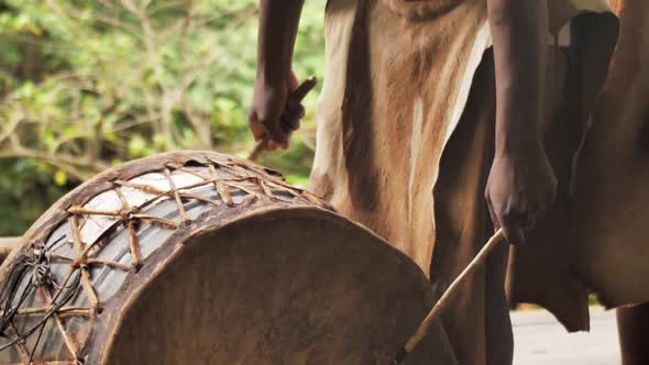 Zulu Tribesman Hitting on a Drum During Traditional Ritual