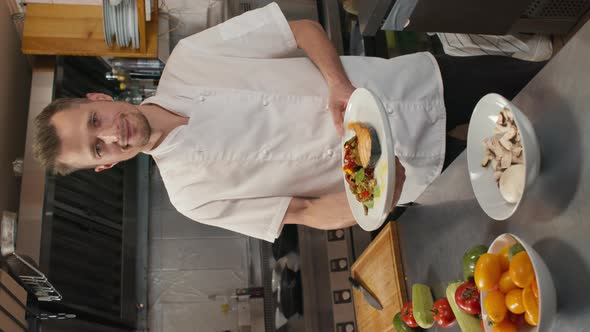 Chef With Prepared Dish On Plate