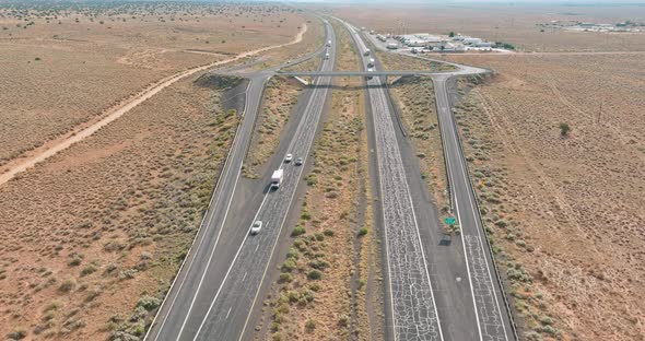 Aerial View of Highway Rest Area with Large Car Park for Cars Trucks Top View of Highway in Desert