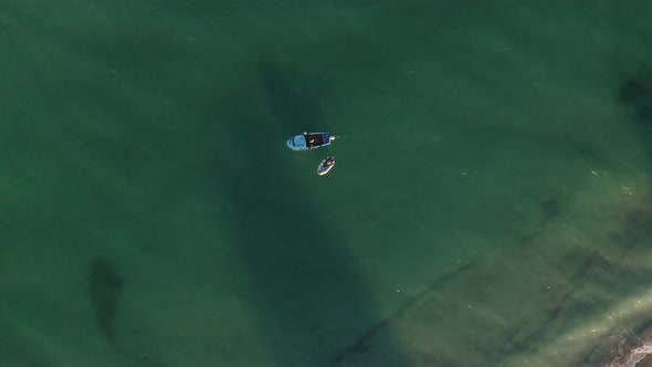 Boats in turquoise green sea