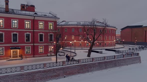 Aerial View of the New Holland Park in a Snowy Winter Evening Night Illumination of Buildings and