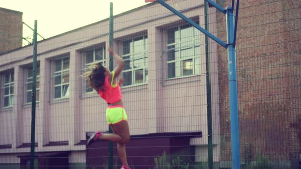 Young Woman Playing Basketball